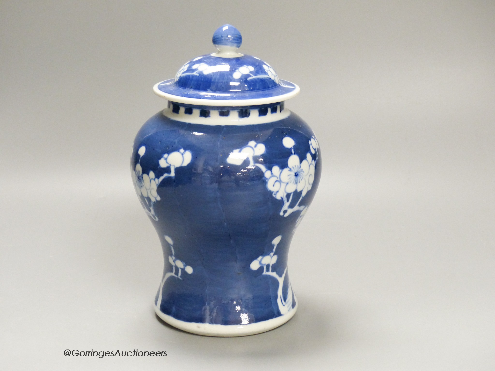 A Chinese blue and white 'prunus' jar and cover, height 22cm